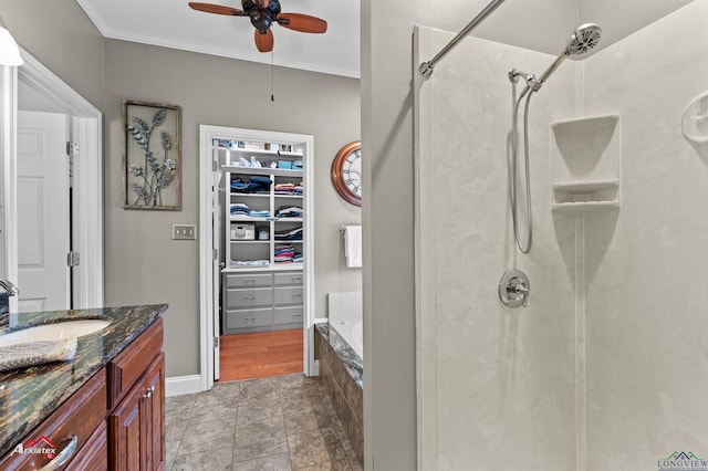 full bath featuring vanity, ornamental molding, a shower, tiled tub, and a ceiling fan