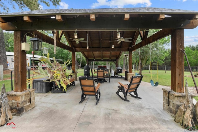 view of patio / terrace with a gazebo, fence, outdoor lounge area, and ceiling fan