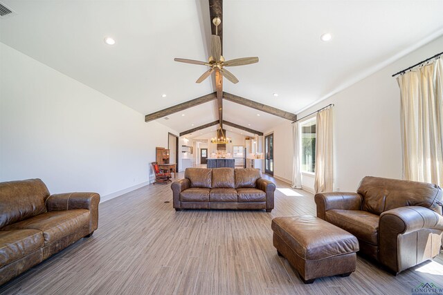 living room with vaulted ceiling with beams, ceiling fan, and wood-type flooring