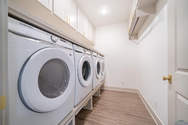 laundry area with light wood-type flooring and independent washer and dryer