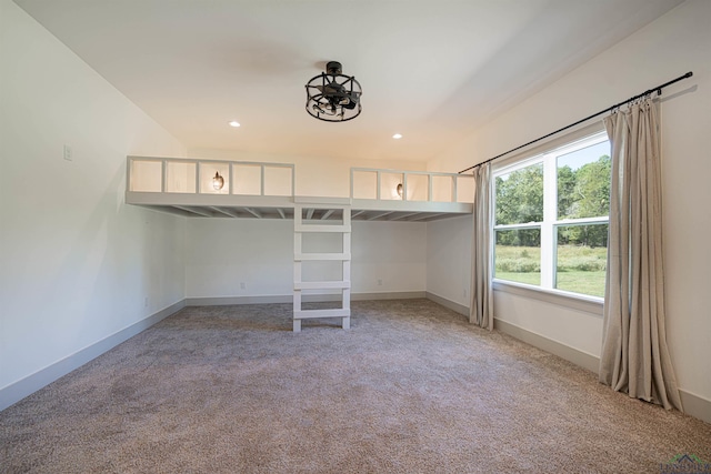 unfurnished bedroom with carpet flooring