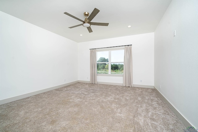 carpeted empty room with ceiling fan