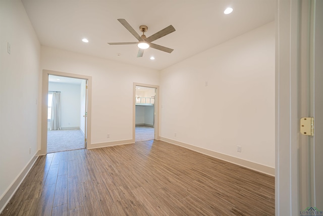 empty room with wood-type flooring and ceiling fan