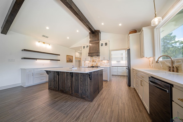 kitchen featuring a large island, sink, a kitchen breakfast bar, tasteful backsplash, and appliances with stainless steel finishes