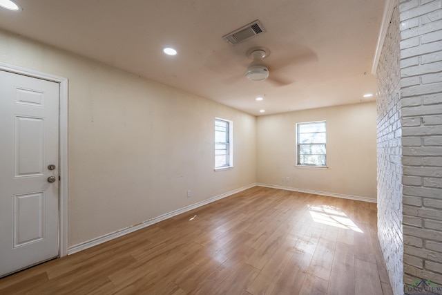 spare room with ceiling fan and light hardwood / wood-style floors