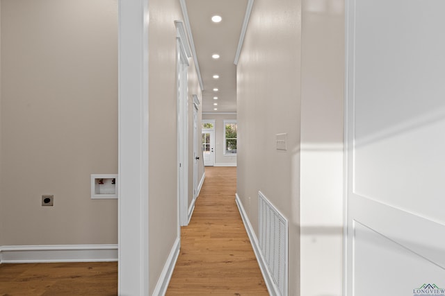 hall with light hardwood / wood-style flooring