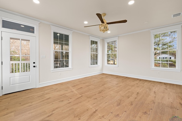 interior space featuring ceiling fan, ornamental molding, and light hardwood / wood-style floors