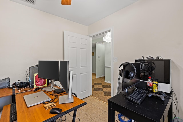 tiled office featuring ceiling fan