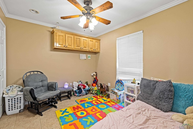 recreation room with crown molding, light tile patterned floors, and ceiling fan