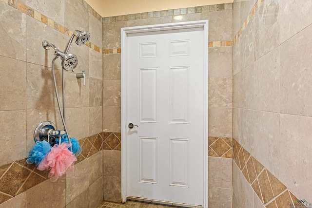 bathroom with tiled shower