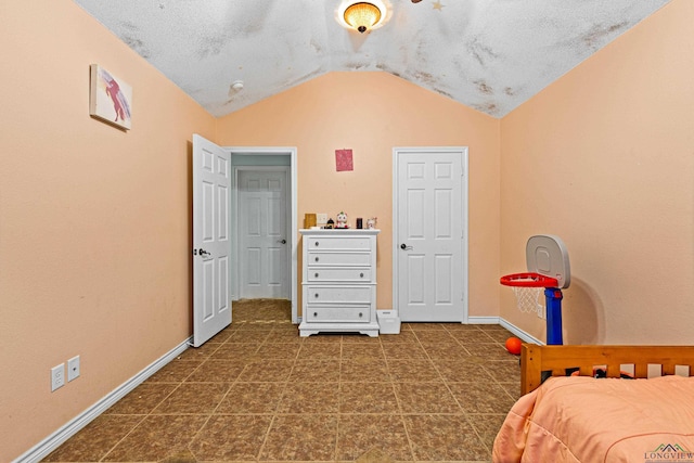 bedroom featuring lofted ceiling