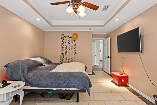 tiled bedroom featuring crown molding, ceiling fan, and a tray ceiling