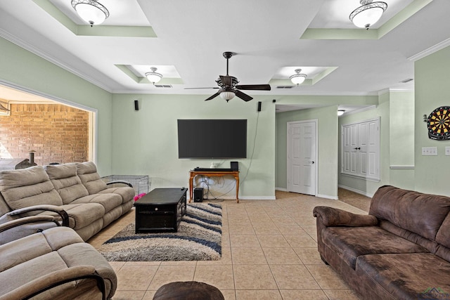 living room featuring crown molding, ceiling fan, a tray ceiling, and light tile patterned floors