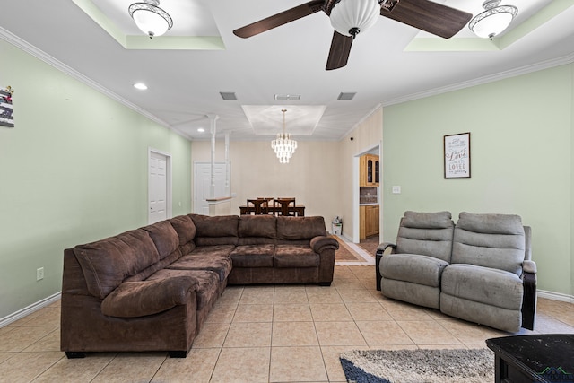 living room featuring light tile patterned flooring, ornamental molding, and ceiling fan with notable chandelier