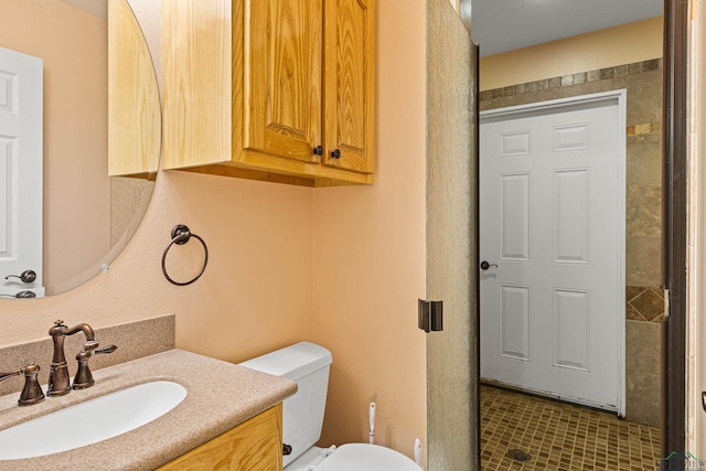 bathroom featuring vanity and toilet