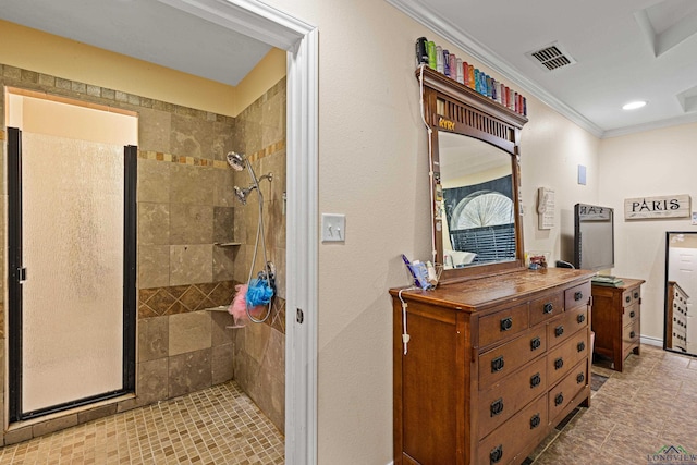 bathroom featuring tiled shower and ornamental molding