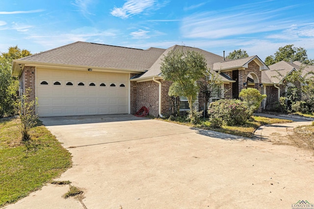 single story home with a garage