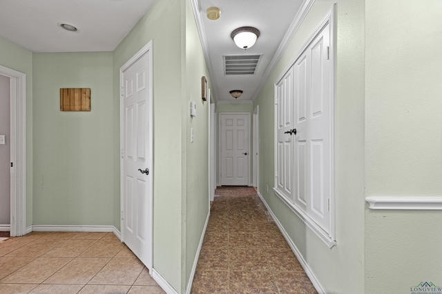 corridor with light tile patterned floors