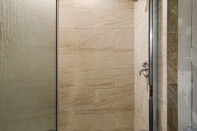 interior details featuring an enclosed shower