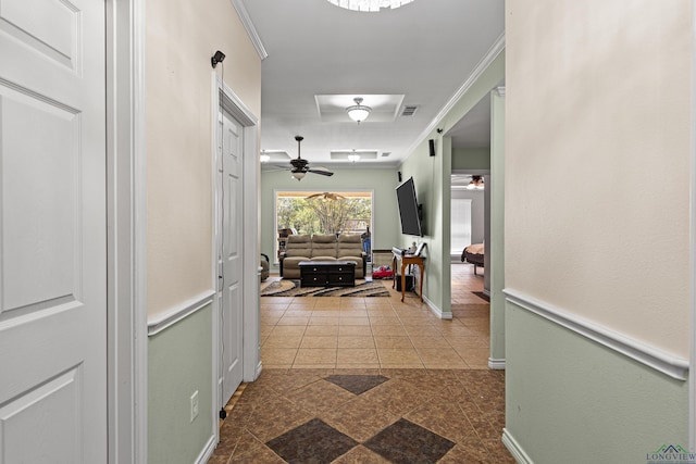 hallway featuring crown molding