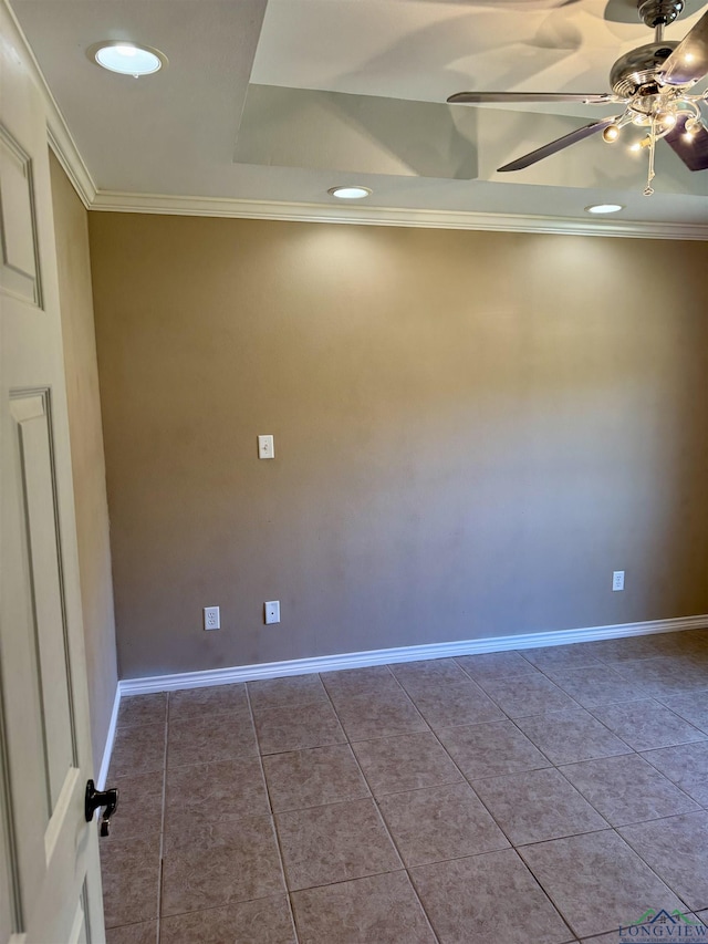 tiled spare room featuring ornamental molding and ceiling fan