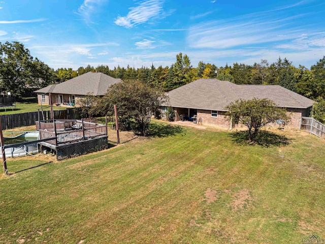 view of yard with a wooden deck