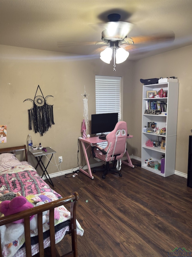 bedroom with ceiling fan, baseboards, and wood finished floors