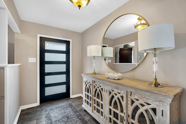 entryway with dark hardwood / wood-style floors