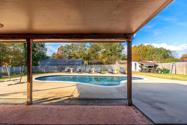 view of swimming pool featuring a patio area