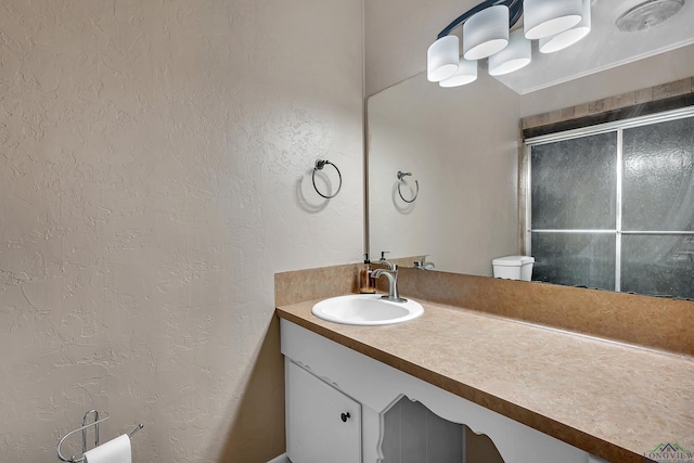 bathroom with vanity and an enclosed shower