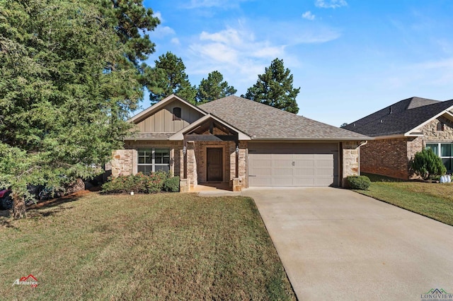 view of front of house with a front yard and a garage