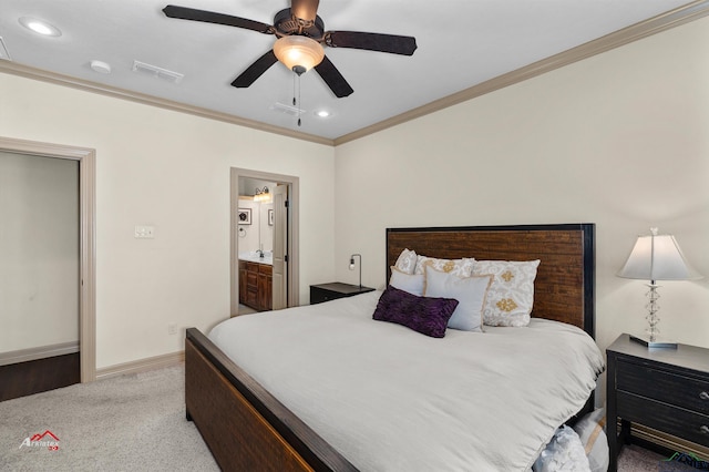 bedroom with ceiling fan, light colored carpet, crown molding, and connected bathroom