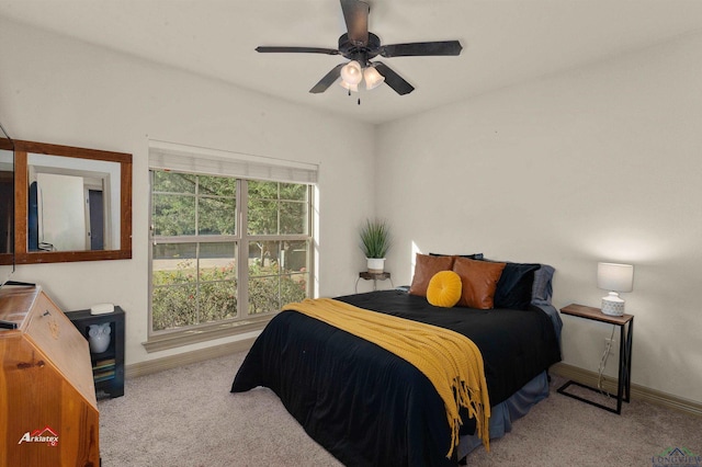 bedroom with ceiling fan and light colored carpet