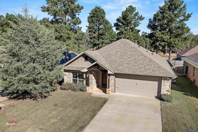 view of front facade with a front yard and a garage