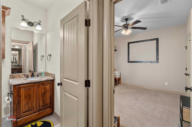 bathroom featuring vanity and ceiling fan