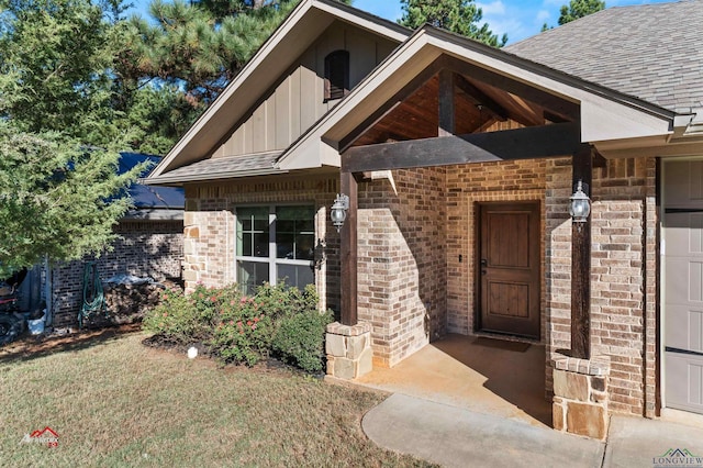 property entrance with a yard