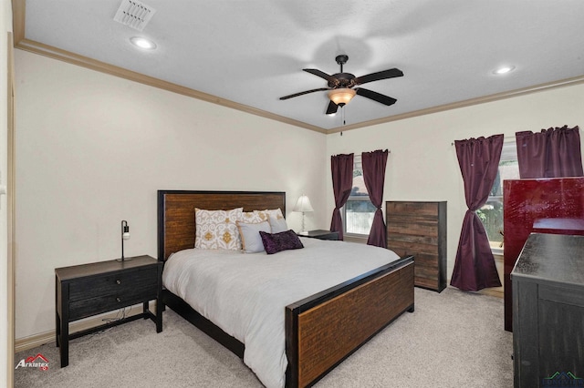 carpeted bedroom featuring multiple windows, ceiling fan, and ornamental molding