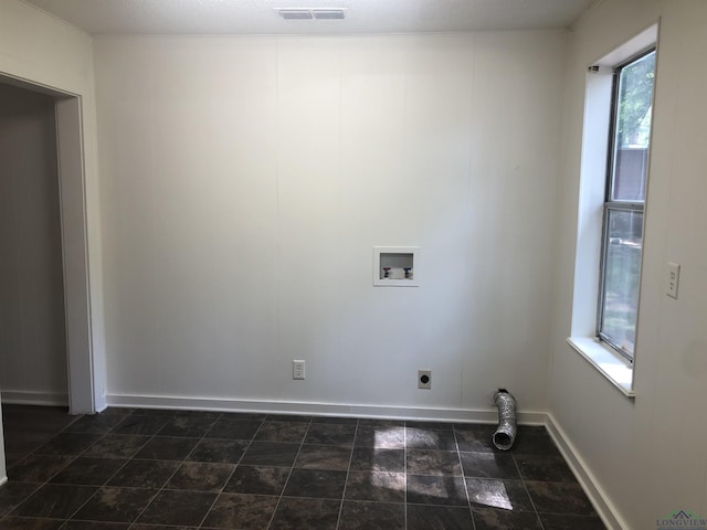602 Premier Rd, Longview, TX 75604 - laundry area featuring hookup for a washing machine, electric dryer hookup, and baseboards