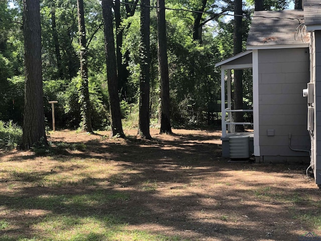 602 Premier Rd, Longview, TX 75604 - view of yard featuring central AC