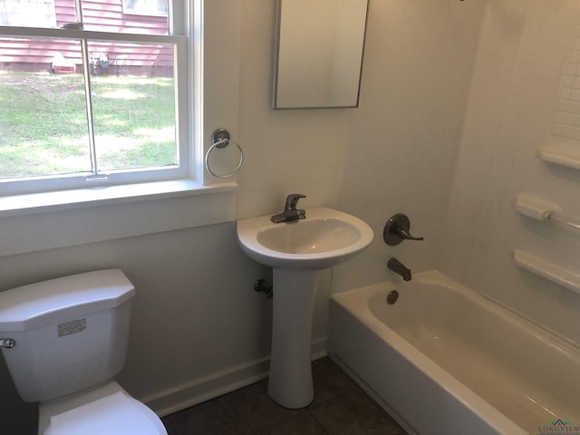 602 Premier Rd, Longview, TX 75604 - full bathroom with healthy amount of natural light, tile patterned floors, toilet, and shower / tub combination