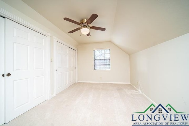 bonus room with ceiling fan, light colored carpet, and lofted ceiling