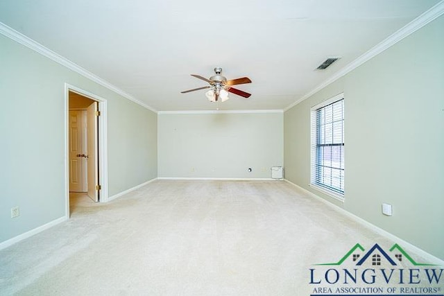 unfurnished room featuring light colored carpet, ceiling fan, and ornamental molding