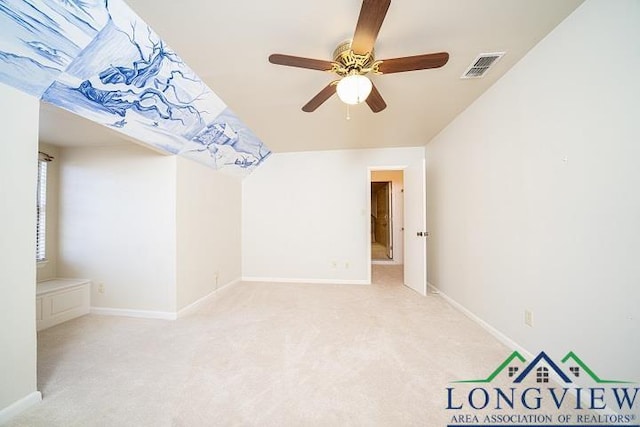 spare room with light carpet and ceiling fan