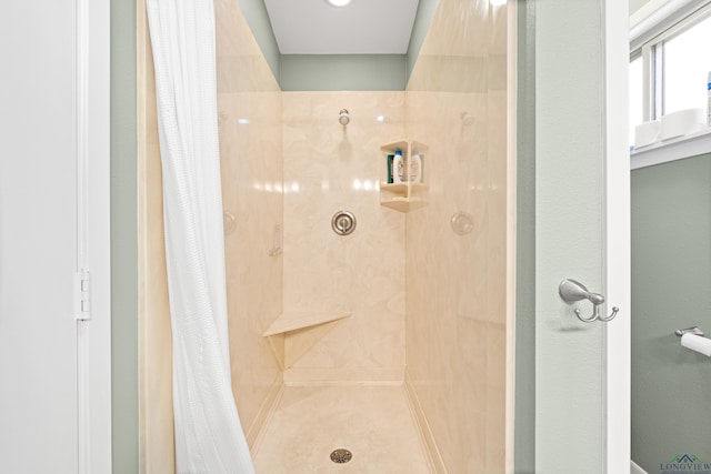 bathroom with a shower with shower curtain