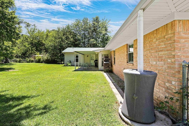 view of yard featuring cooling unit and a patio area