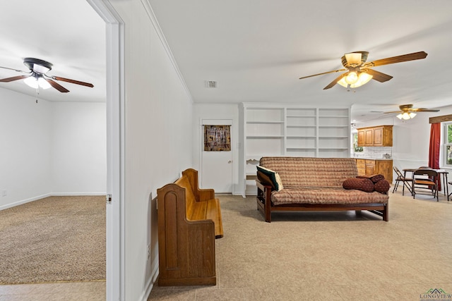 living room with light colored carpet and crown molding