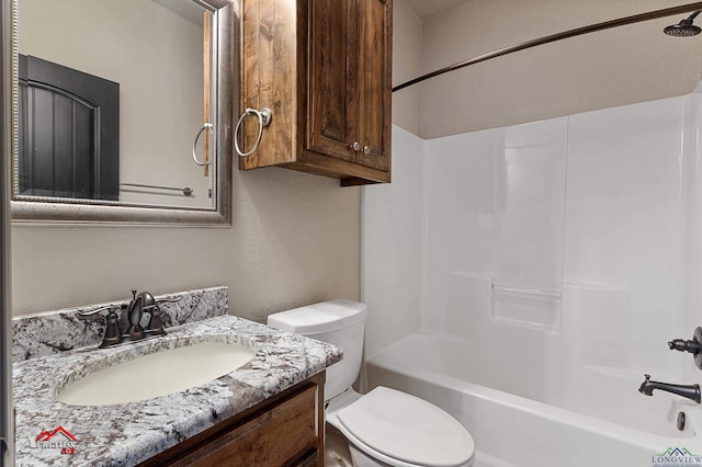 full bathroom featuring shower / tub combination, vanity, and toilet