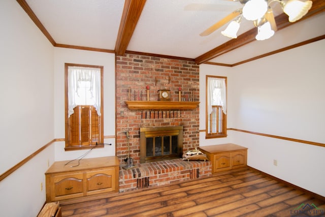 living room featuring ceiling fan and a fireplace