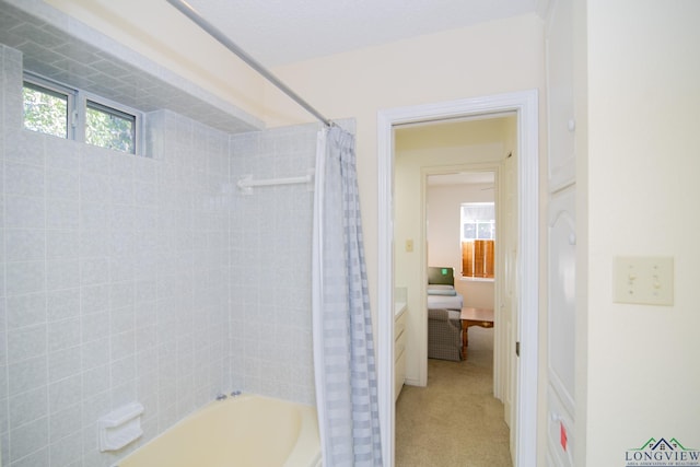 bathroom with shower / bath combo and vanity