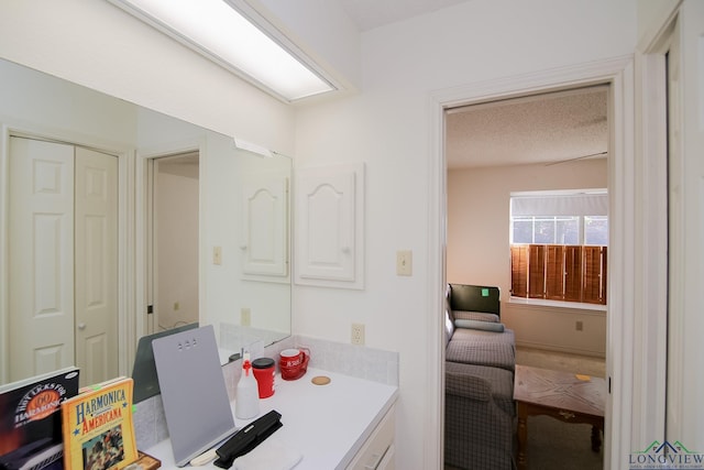 bathroom with a textured ceiling